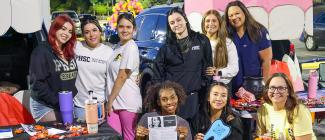 Nine PHSC female students at the Trunk or Treat event at the West Campus